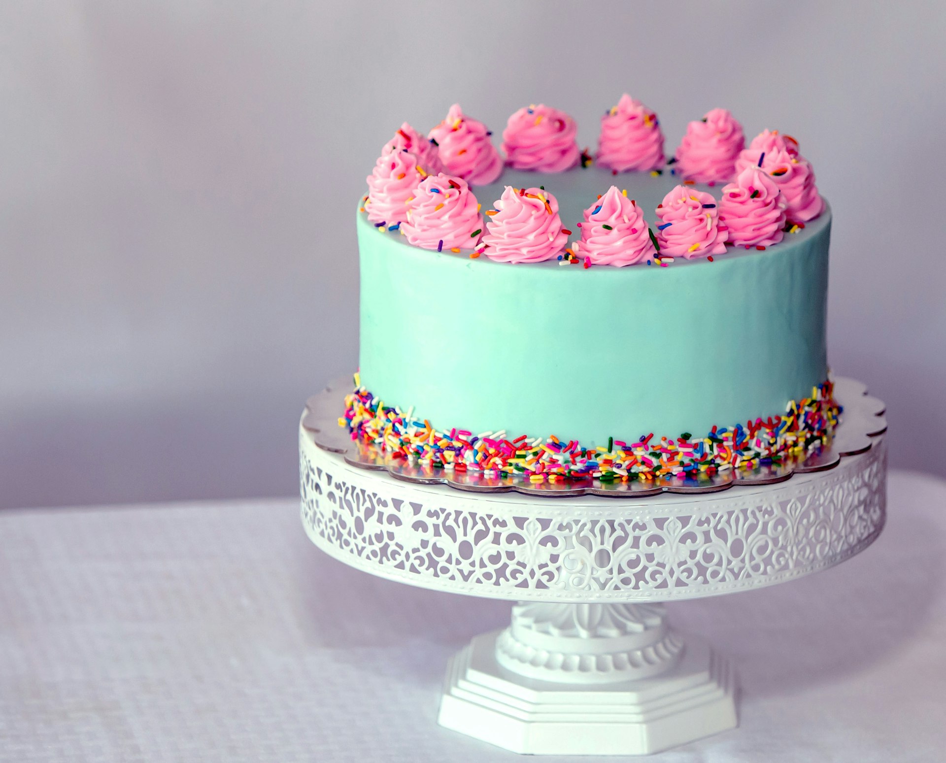 A layered, floral-decorated celebration cake — the kind of order xcoms is built to handle.